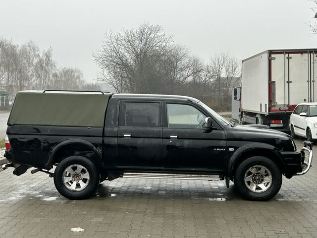 Черный Мицубиси Л 200, объемом двигателя 2.5 л и пробегом 170 тыс. км за 4250 $, фото 1 на Automoto.ua