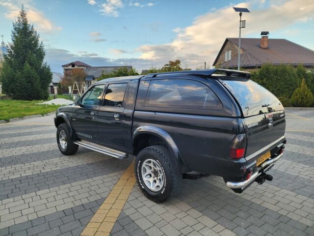 Черный Мицубиси Л 200, объемом двигателя 2.5 л и пробегом 156 тыс. км за 7521 $, фото 6 на Automoto.ua