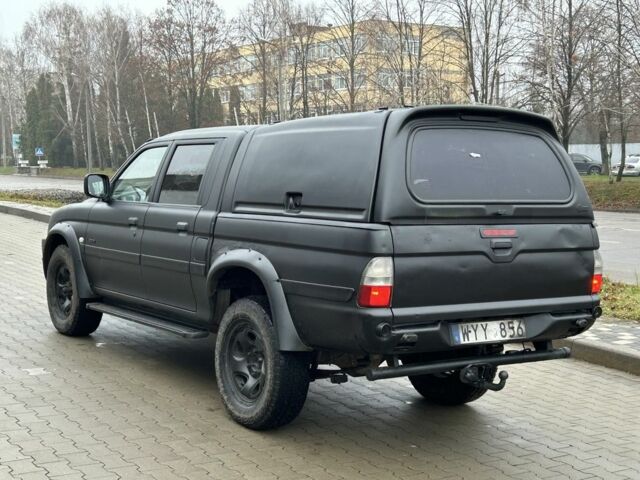 Черный Мицубиси Л 200, объемом двигателя 2.5 л и пробегом 250 тыс. км за 4250 $, фото 2 на Automoto.ua