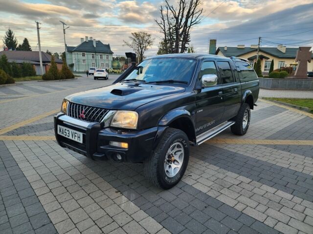 Черный Мицубиси Л 200, объемом двигателя 2.5 л и пробегом 156 тыс. км за 7521 $, фото 5 на Automoto.ua