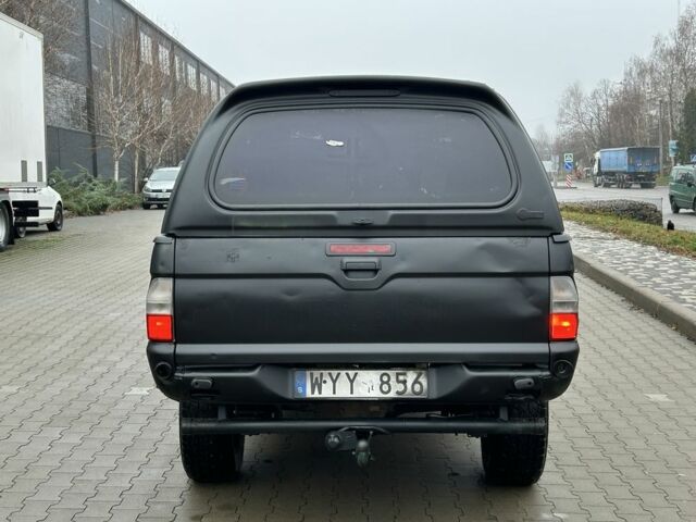 Черный Мицубиси Л 200, объемом двигателя 2.5 л и пробегом 250 тыс. км за 4250 $, фото 3 на Automoto.ua