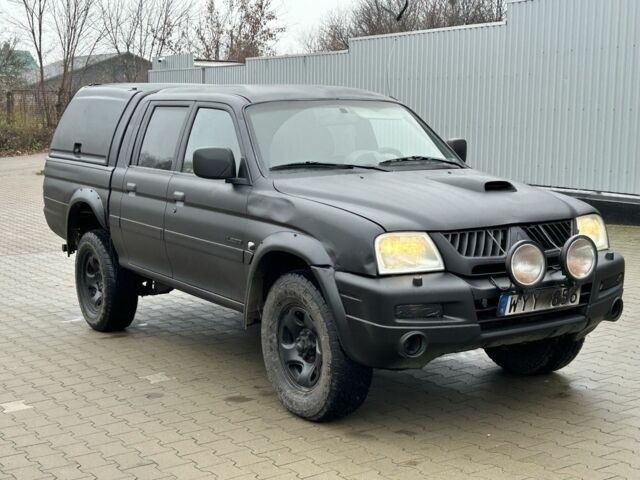 Черный Мицубиси Л 200, объемом двигателя 2.5 л и пробегом 250 тыс. км за 4250 $, фото 6 на Automoto.ua