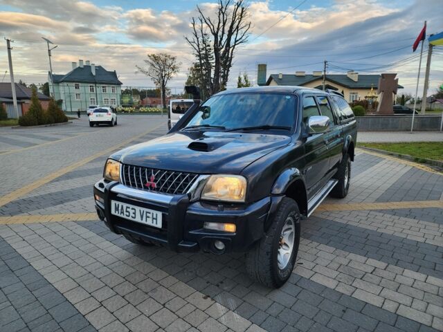 Черный Мицубиси Л 200, объемом двигателя 2.5 л и пробегом 156 тыс. км за 7521 $, фото 4 на Automoto.ua