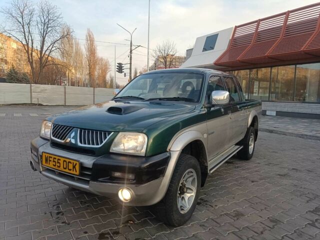 Черный Мицубиси Л 200, объемом двигателя 2.5 л и пробегом 300 тыс. км за 5100 $, фото 1 на Automoto.ua