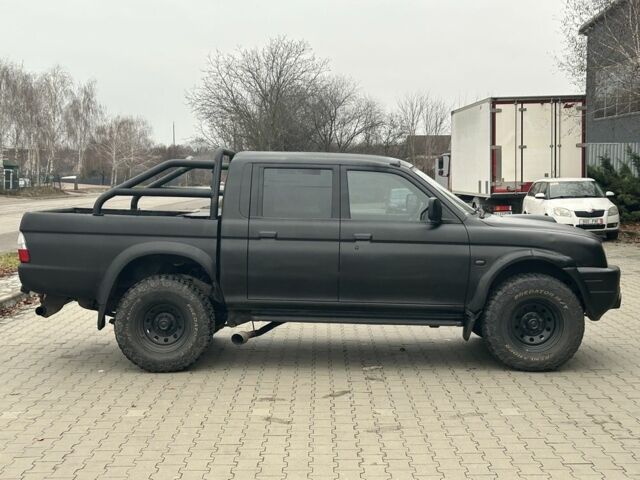 Чорний Міцубісі Л 200, об'ємом двигуна 2.5 л та пробігом 150 тис. км за 4250 $, фото 1 на Automoto.ua