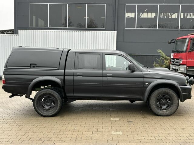 Черный Мицубиси Л 200, объемом двигателя 2.5 л и пробегом 250 тыс. км за 4250 $, фото 5 на Automoto.ua