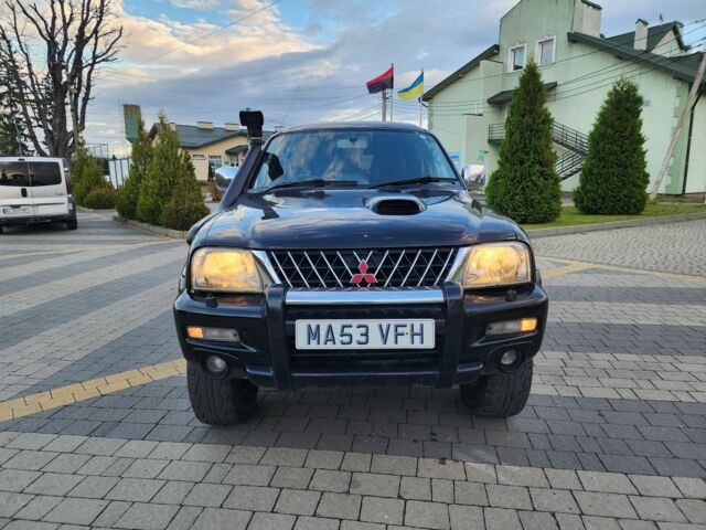 Черный Мицубиси Л 200, объемом двигателя 2.5 л и пробегом 156 тыс. км за 7521 $, фото 3 на Automoto.ua