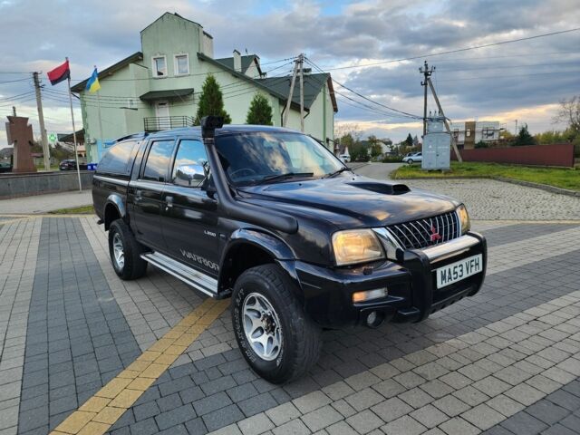 Черный Мицубиси Л 200, объемом двигателя 2.5 л и пробегом 156 тыс. км за 7521 $, фото 2 на Automoto.ua