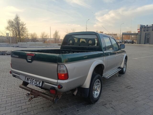 Черный Мицубиси Л 200, объемом двигателя 2.5 л и пробегом 300 тыс. км за 5100 $, фото 3 на Automoto.ua