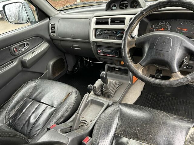 Черный Мицубиси Л 200, объемом двигателя 2.5 л и пробегом 170 тыс. км за 4250 $, фото 10 на Automoto.ua