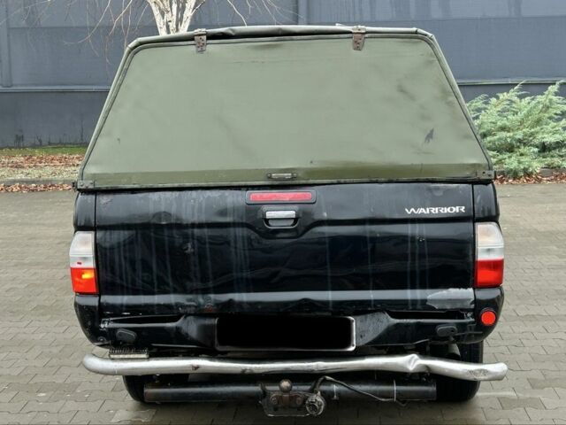 Черный Мицубиси Л 200, объемом двигателя 2.5 л и пробегом 170 тыс. км за 4250 $, фото 3 на Automoto.ua