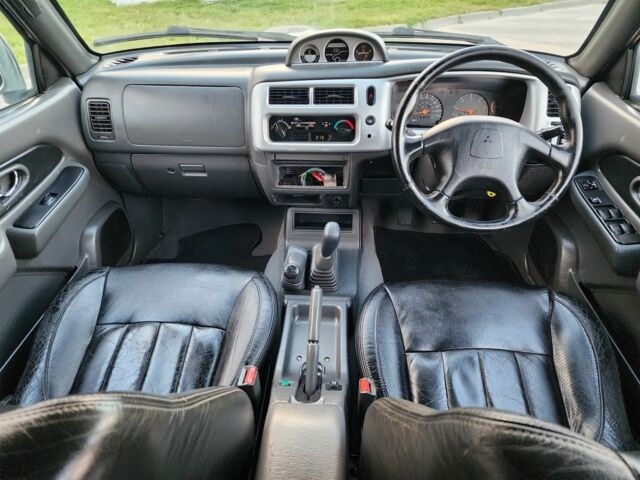 Черный Мицубиси Л 200, объемом двигателя 2.5 л и пробегом 156 тыс. км за 7521 $, фото 20 на Automoto.ua