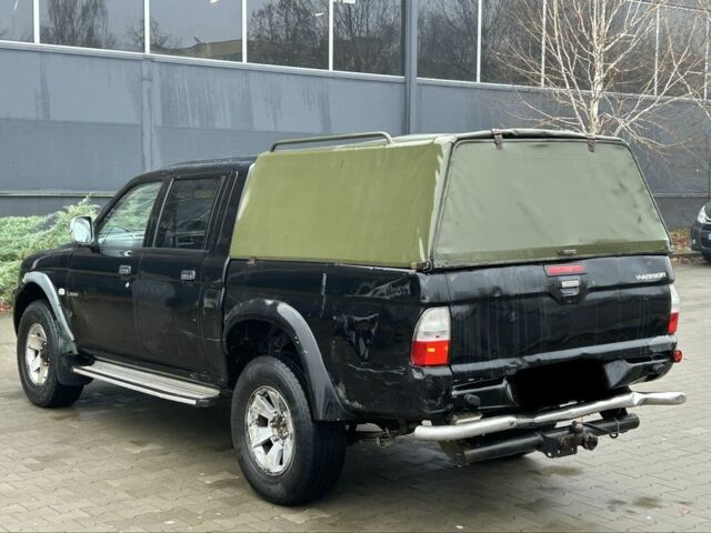 Черный Мицубиси Л 200, объемом двигателя 2.5 л и пробегом 170 тыс. км за 4250 $, фото 4 на Automoto.ua