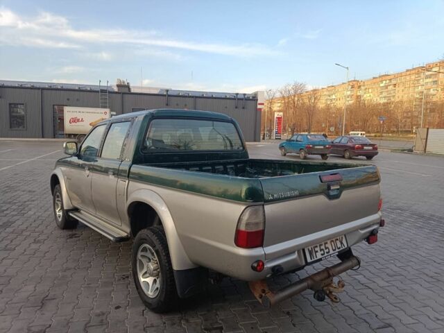 Черный Мицубиси Л 200, объемом двигателя 2.5 л и пробегом 300 тыс. км за 5100 $, фото 2 на Automoto.ua
