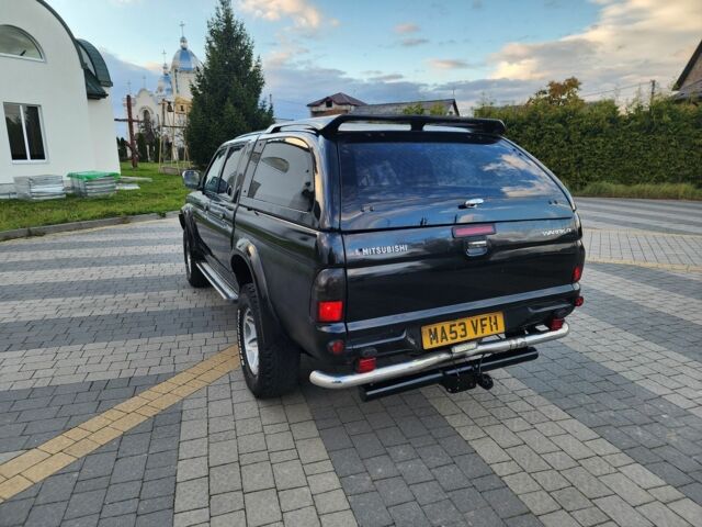 Черный Мицубиси Л 200, объемом двигателя 2.5 л и пробегом 156 тыс. км за 7521 $, фото 7 на Automoto.ua