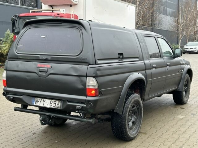 Черный Мицубиси Л 200, объемом двигателя 2.5 л и пробегом 250 тыс. км за 4250 $, фото 4 на Automoto.ua