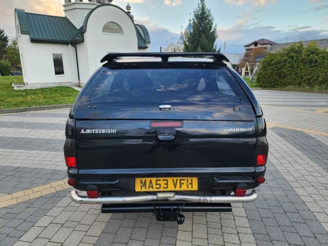 Черный Мицубиси Л 200, объемом двигателя 2.5 л и пробегом 156 тыс. км за 7521 $, фото 8 на Automoto.ua