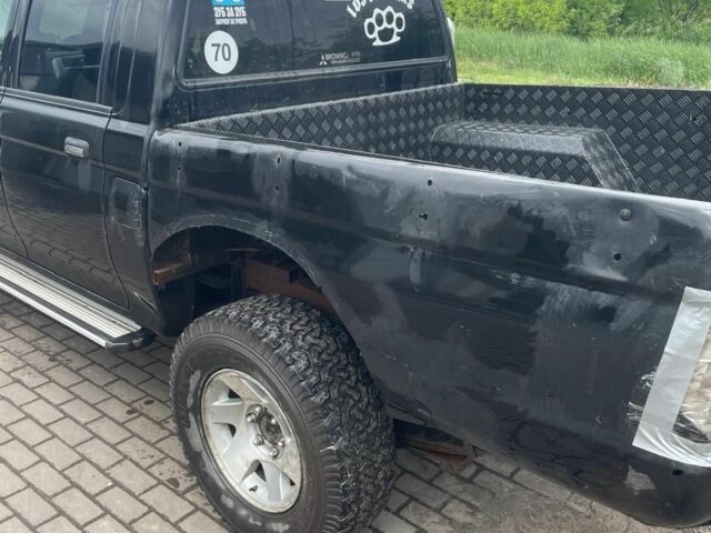 Мицубиси Л 200 2006 в Белой Церкве на Automoto.ua Черный Мицубиси Л 200, объемом двигателя 0 л и пробегом 300 тыс. км за 4500 $, фото 4 на Automoto.ua