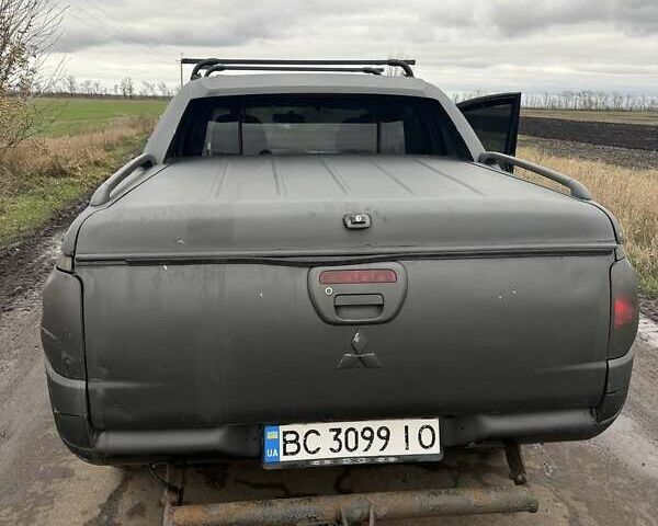 Черный Мицубиси Л 200, объемом двигателя 2.5 л и пробегом 500 тыс. км за 9300 $, фото 4 на Automoto.ua