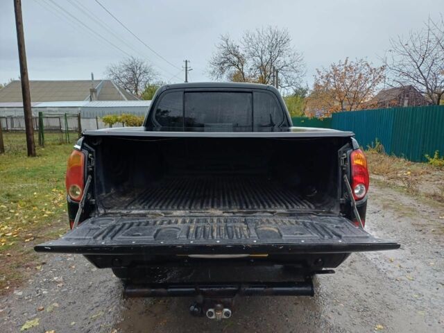 Черный Мицубиси Л 200, объемом двигателя 2.5 л и пробегом 170 тыс. км за 5900 $, фото 8 на Automoto.ua