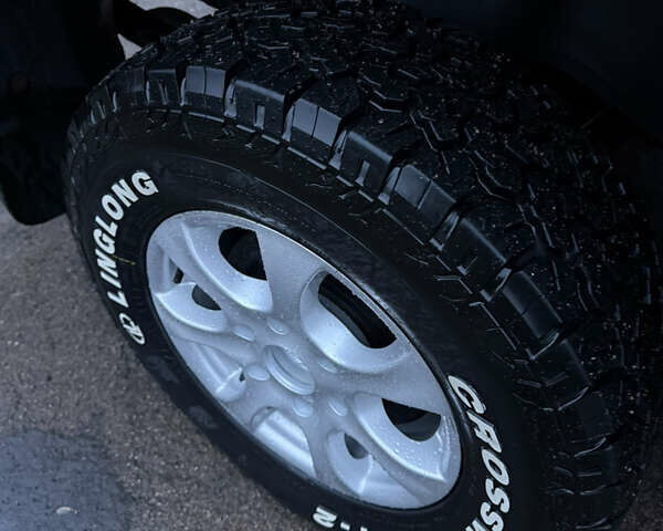 Черный Мицубиси Л 200, объемом двигателя 2.5 л и пробегом 199 тыс. км за 11800 $, фото 3 на Automoto.ua