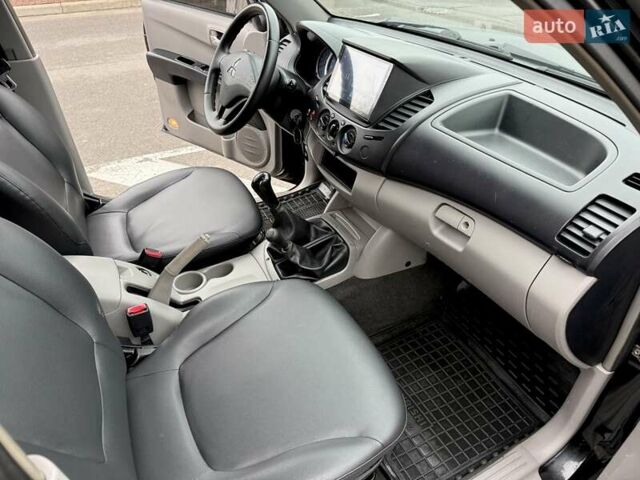 Черный Мицубиси Л 200, объемом двигателя 2.48 л и пробегом 232 тыс. км за 13900 $, фото 40 на Automoto.ua