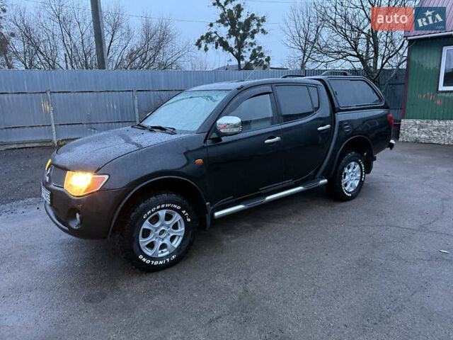Черный Мицубиси Л 200, объемом двигателя 2.5 л и пробегом 199 тыс. км за 11800 $, фото 13 на Automoto.ua