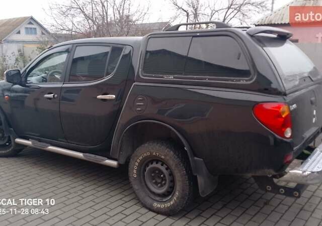 Чорний Міцубісі Л 200, об'ємом двигуна 2.48 л та пробігом 198 тис. км за 11500 $, фото 1 на Automoto.ua