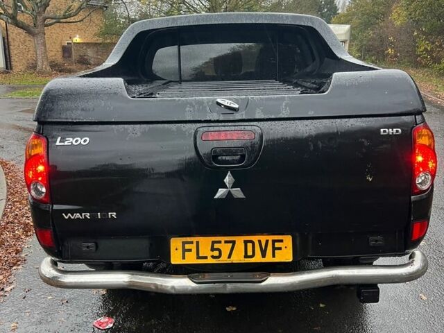 Черный Мицубиси Л 200, объемом двигателя 2.5 л и пробегом 190 тыс. км за 6655 $, фото 4 на Automoto.ua