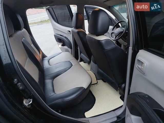 Чорний Міцубісі Л 200, об'ємом двигуна 2.48 л та пробігом 290 тис. км за 9900 $, фото 13 на Automoto.ua