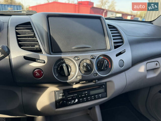 Мицубиси Л 200 2007 в Киеве на Automoto.ua Черный Мицубиси Л 200, объемом двигателя 2.48 л и пробегом 283 тыс. км за 10999 $, фото 30 на Automoto.ua