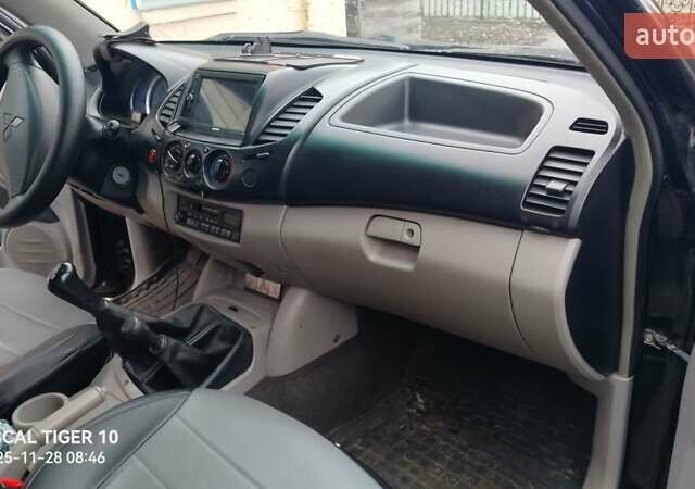 Чорний Міцубісі Л 200, об'ємом двигуна 2.48 л та пробігом 198 тис. км за 11500 $, фото 2 на Automoto.ua