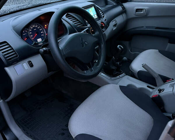 Черный Мицубиси Л 200, объемом двигателя 2.5 л и пробегом 199 тыс. км за 11800 $, фото 11 на Automoto.ua