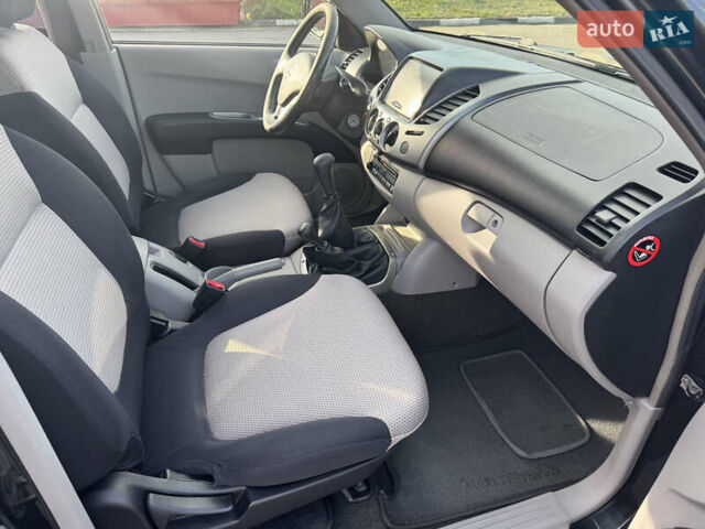 Мицубиси Л 200 2007 в Киеве на Automoto.ua Черный Мицубиси Л 200, объемом двигателя 2.48 л и пробегом 283 тыс. км за 10999 $, фото 9 на Automoto.ua