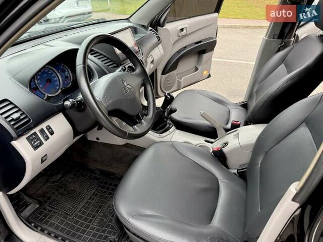 Черный Мицубиси Л 200, объемом двигателя 2.48 л и пробегом 232 тыс. км за 13900 $, фото 57 на Automoto.ua