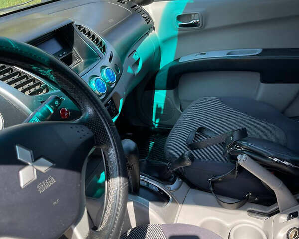 Черный Мицубиси Л 200, объемом двигателя 2.5 л и пробегом 221 тыс. км за 12800 $, фото 10 на Automoto.ua