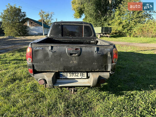 Черный Мицубиси Л 200, объемом двигателя 2.48 л и пробегом 320 тыс. км за 7500 $, фото 5 на Automoto.ua