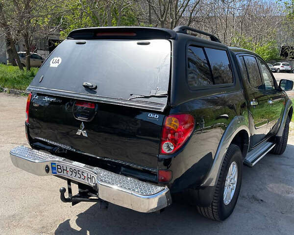 Черный Мицубиси Л 200, объемом двигателя 2.5 л и пробегом 221 тыс. км за 12800 $, фото 6 на Automoto.ua