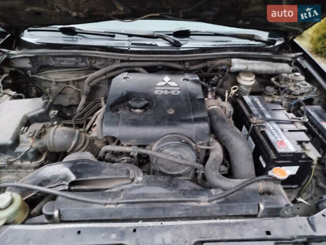 Чорний Міцубісі Л 200, об'ємом двигуна 2.48 л та пробігом 219 тис. км за 10500 $, фото 32 на Automoto.ua