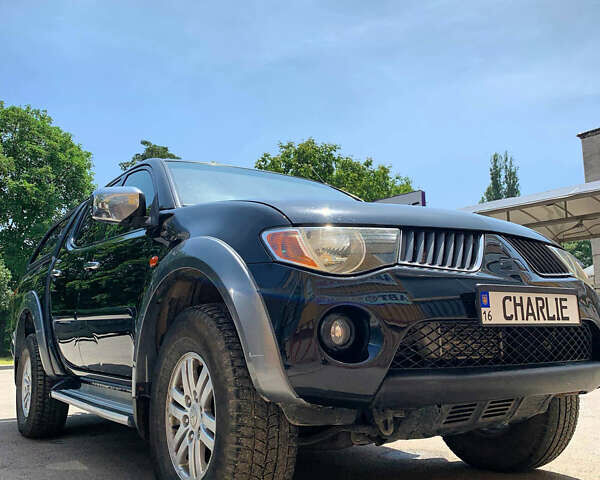 Черный Мицубиси Л 200, объемом двигателя 2.5 л и пробегом 221 тыс. км за 12800 $, фото 16 на Automoto.ua