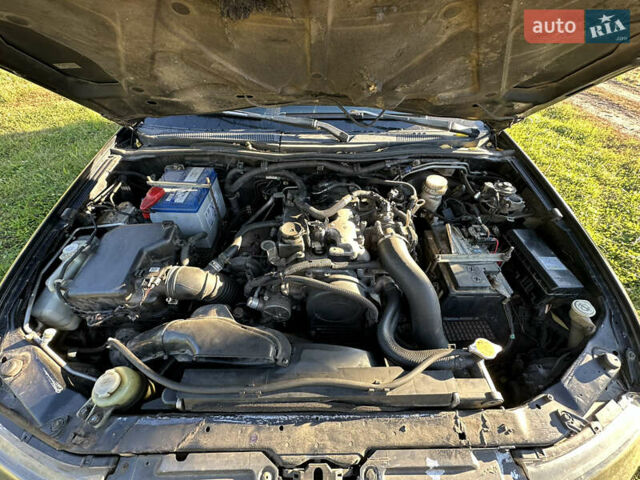 Черный Мицубиси Л 200, объемом двигателя 2.48 л и пробегом 320 тыс. км за 7500 $, фото 6 на Automoto.ua