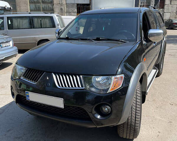 Черный Мицубиси Л 200, объемом двигателя 2.5 л и пробегом 221 тыс. км за 12800 $, фото 14 на Automoto.ua