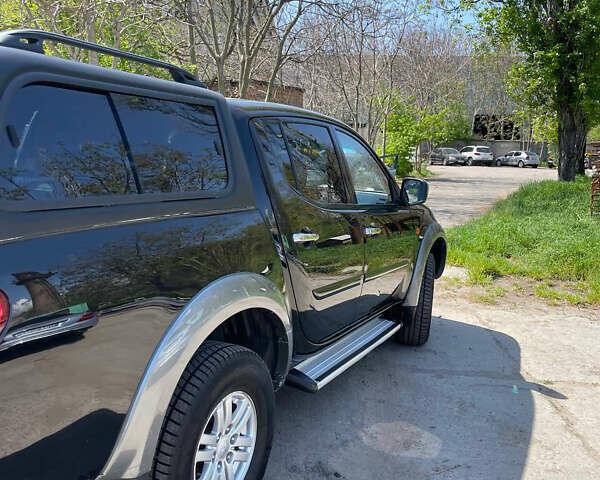 Черный Мицубиси Л 200, объемом двигателя 2.5 л и пробегом 221 тыс. км за 12800 $, фото 18 на Automoto.ua