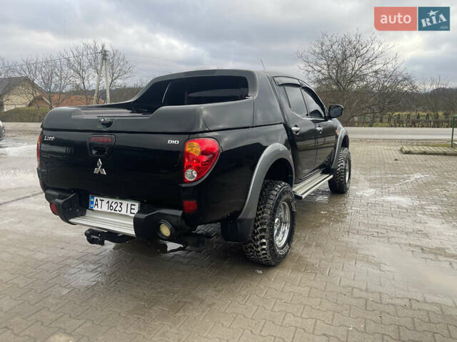Черный Мицубиси Л 200, объемом двигателя 2.48 л и пробегом 370 тыс. км за 12750 $, фото 3 на Automoto.ua