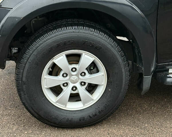 Черный Мицубиси Л 200, объемом двигателя 2.5 л и пробегом 261 тыс. км за 12300 $, фото 14 на Automoto.ua