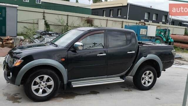 Черный Мицубиси Л 200, объемом двигателя 2.48 л и пробегом 291 тыс. км за 11000 $, фото 6 на Automoto.ua