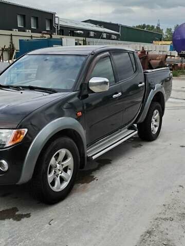 Черный Мицубиси Л 200, объемом двигателя 2.48 л и пробегом 291 тыс. км за 11000 $, фото 7 на Automoto.ua