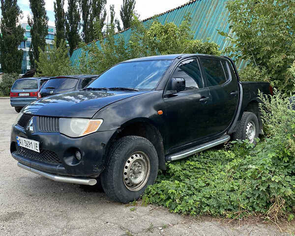 Чорний Міцубісі Л 200, об'ємом двигуна 2.48 л та пробігом 300 тис. км за 5000 $, фото 1 на Automoto.ua