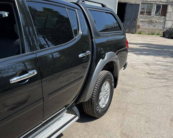 Черный Мицубиси Л 200, объемом двигателя 2.5 л и пробегом 221 тыс. км за 12800 $, фото 9 на Automoto.ua