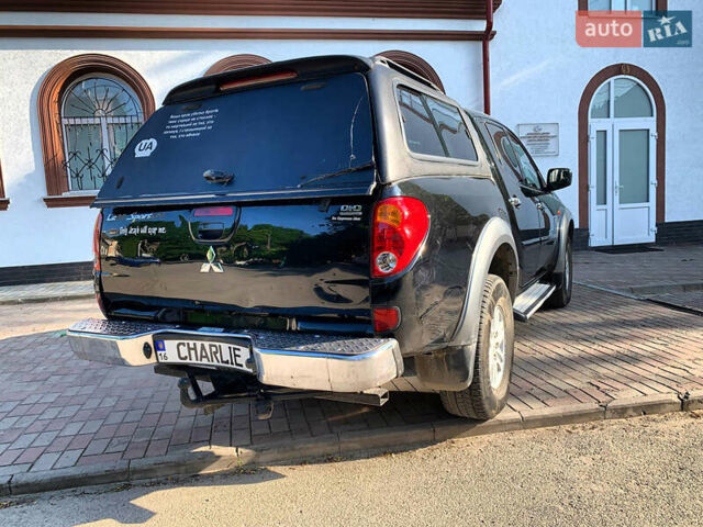 Черный Мицубиси Л 200, объемом двигателя 2.5 л и пробегом 221 тыс. км за 12800 $, фото 8 на Automoto.ua